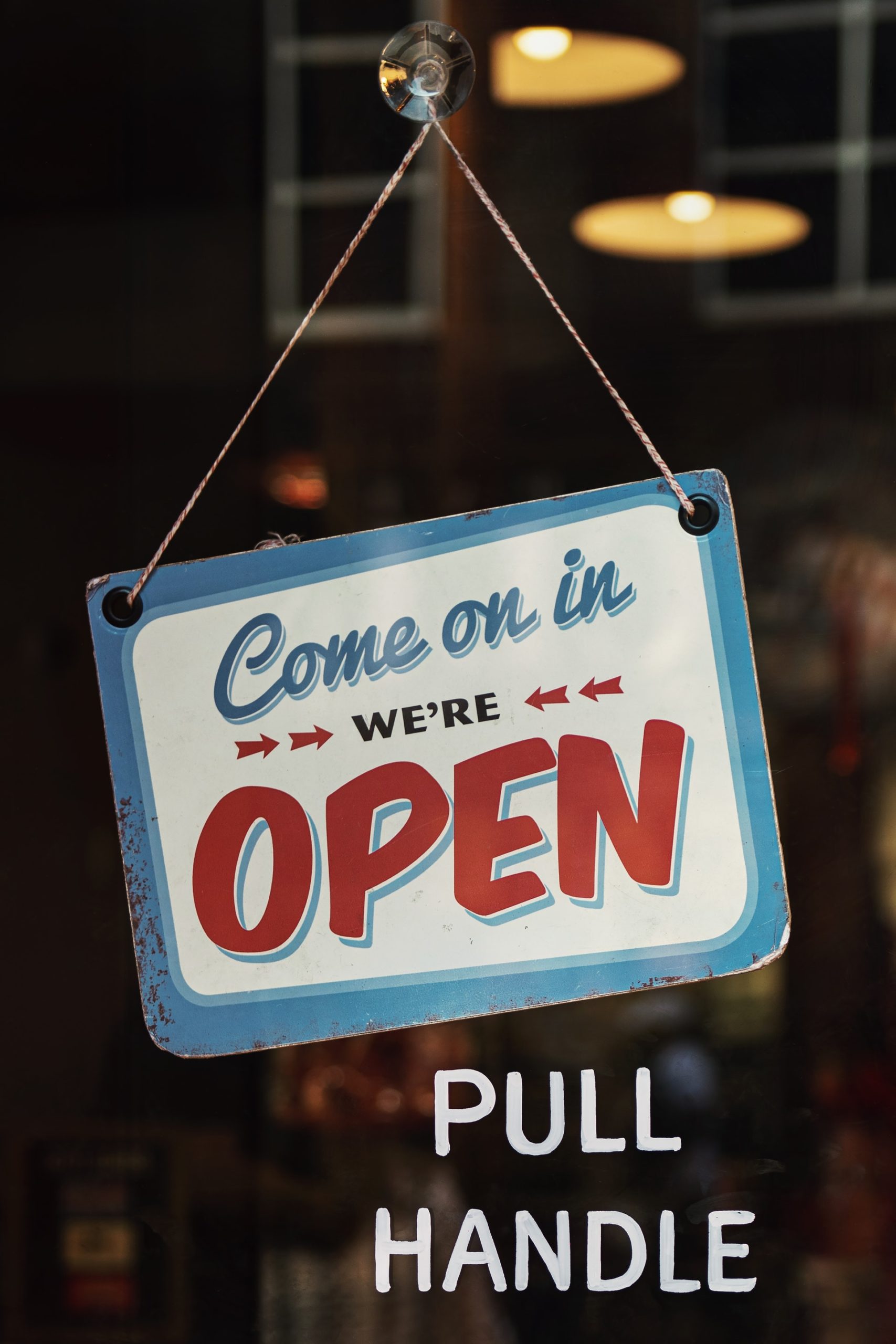 white-and-blue-come-on-in-we-ere-open-signage-2432221